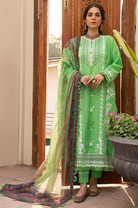 A women standing in light green pakistani suit