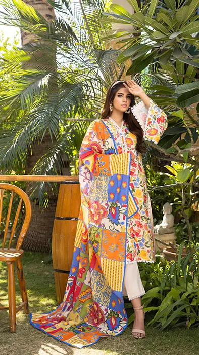 A Women Standing in Floral Print Pakistani Suit by Gul Ahmed