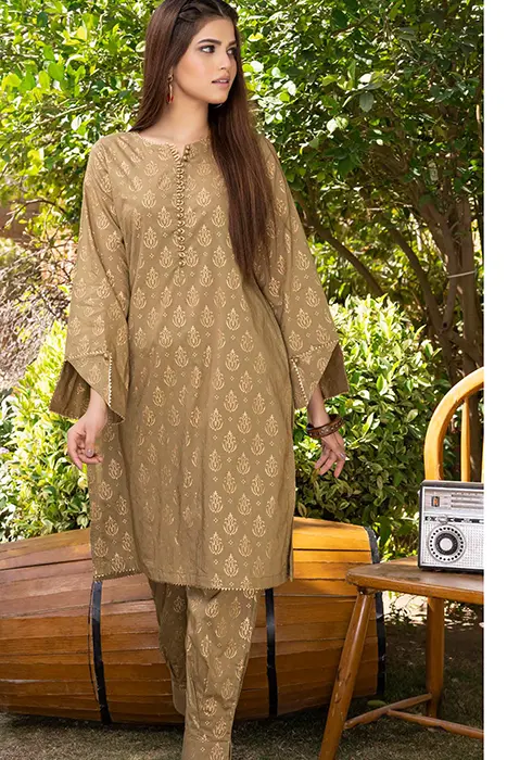 A Women Standing in Golden Pakistani Suit by Gul Ahmed
