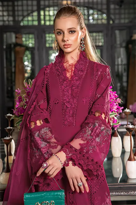 A Beautiful Woman Carry a Magenta Pakistani Lawn suit by Maria.B