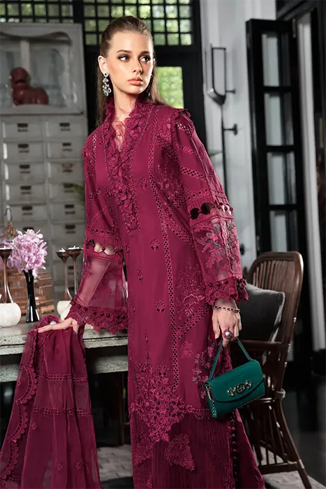A Beautiful Woman Carry a Magenta Pakistani Lawn suit by Maria.B