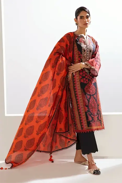 A Women Standing in Floral Red pakistani suit