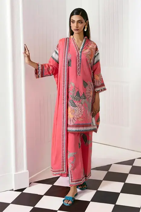 A Women Standing in pink pakistani suit by sana safinaz