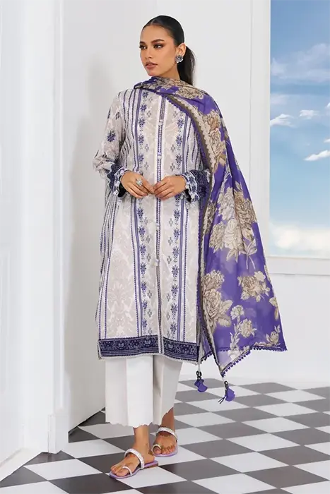 A standing woman in printed pakistani suit by sana safinaz