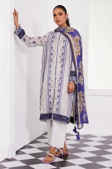 A standing woman in printed pakistani suit by sana safinaz