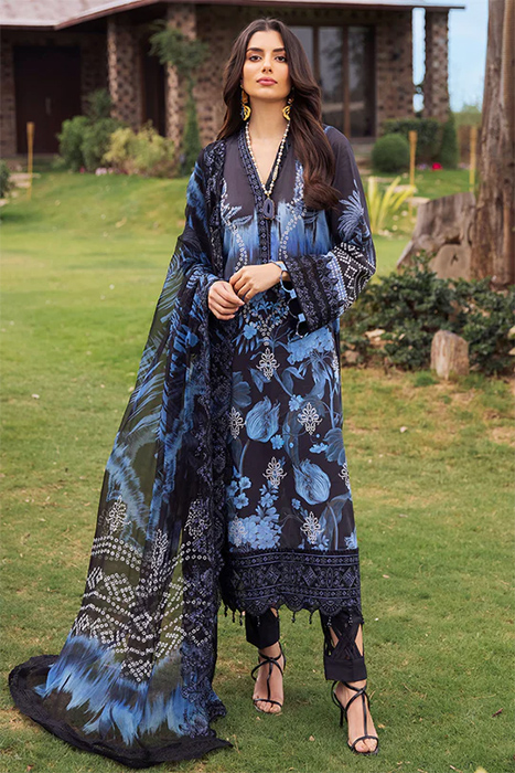 A Woman standing in Pakistani Salwar suit